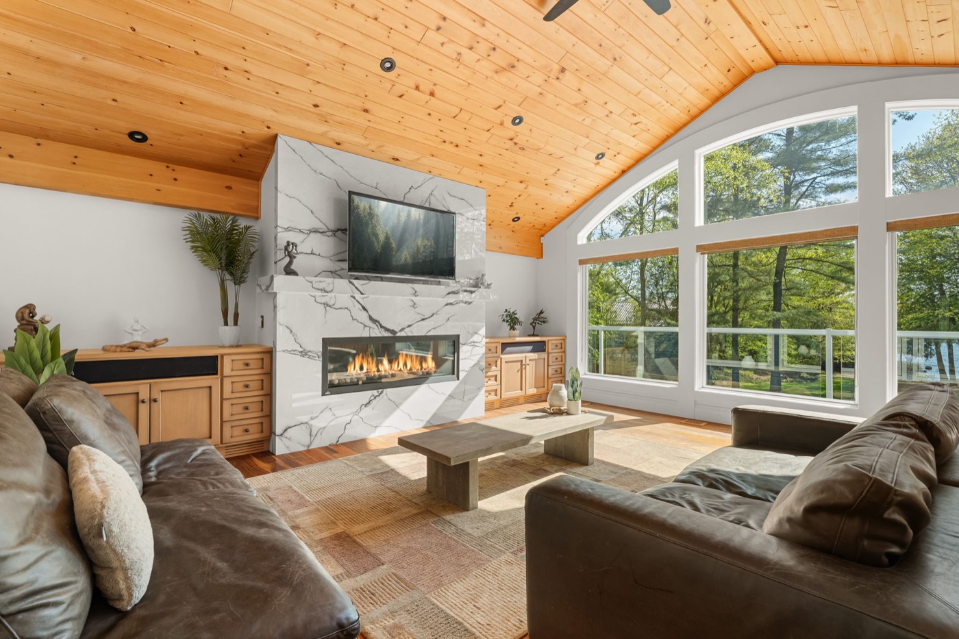 Great room with marble fireplace and lake views