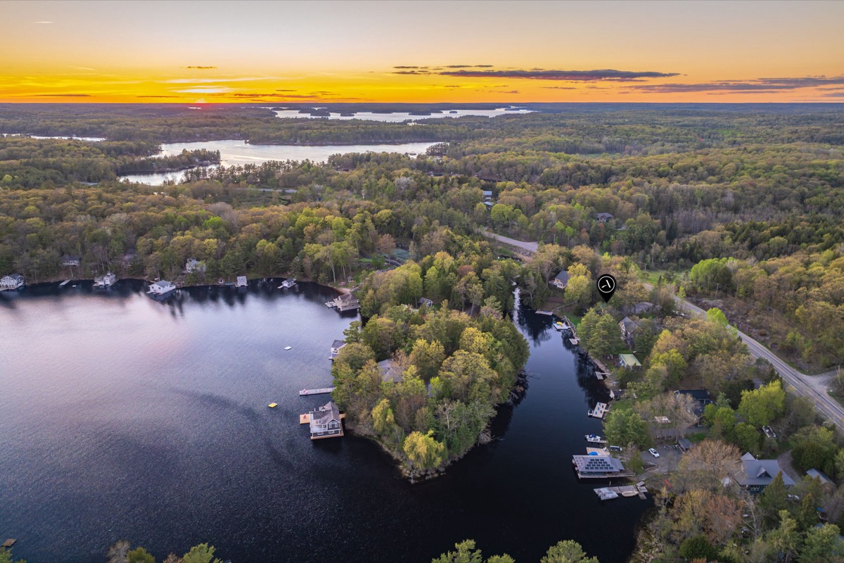Sunset aerial of the Lake Muskoka cottage at 2787 Muskoka Road 118 West
